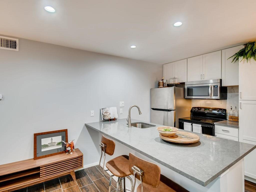 910 Duncan Lane, Unit 16 Austin, TX 78705 - Photo 7 of 15 a living room with stainless steel appliances furniture a dining table and chairs
