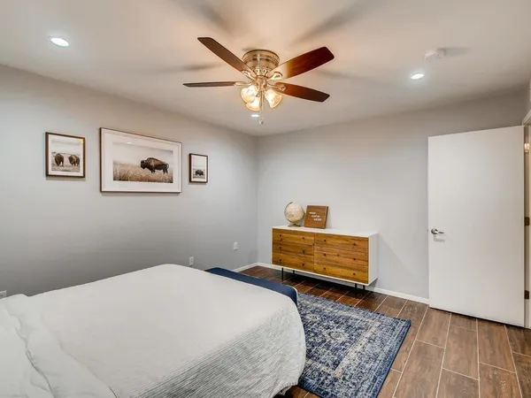 a bedroom with a bed and a dresser