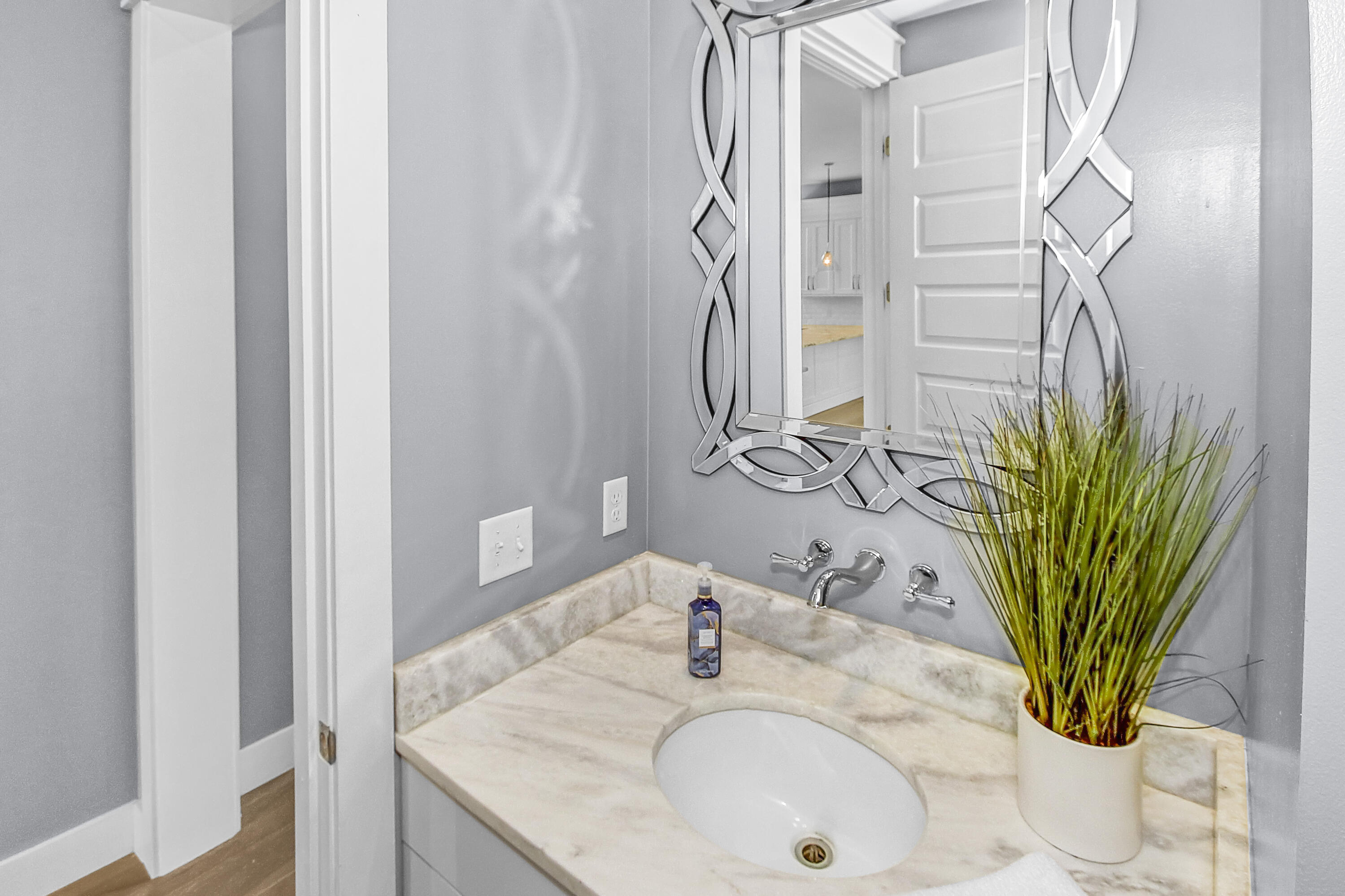 55 Grande Pointe Circle Inlet Beach, FL 32461 - Photo 11 of 32 a bathroom with a granite countertop sink a mirror and a shower