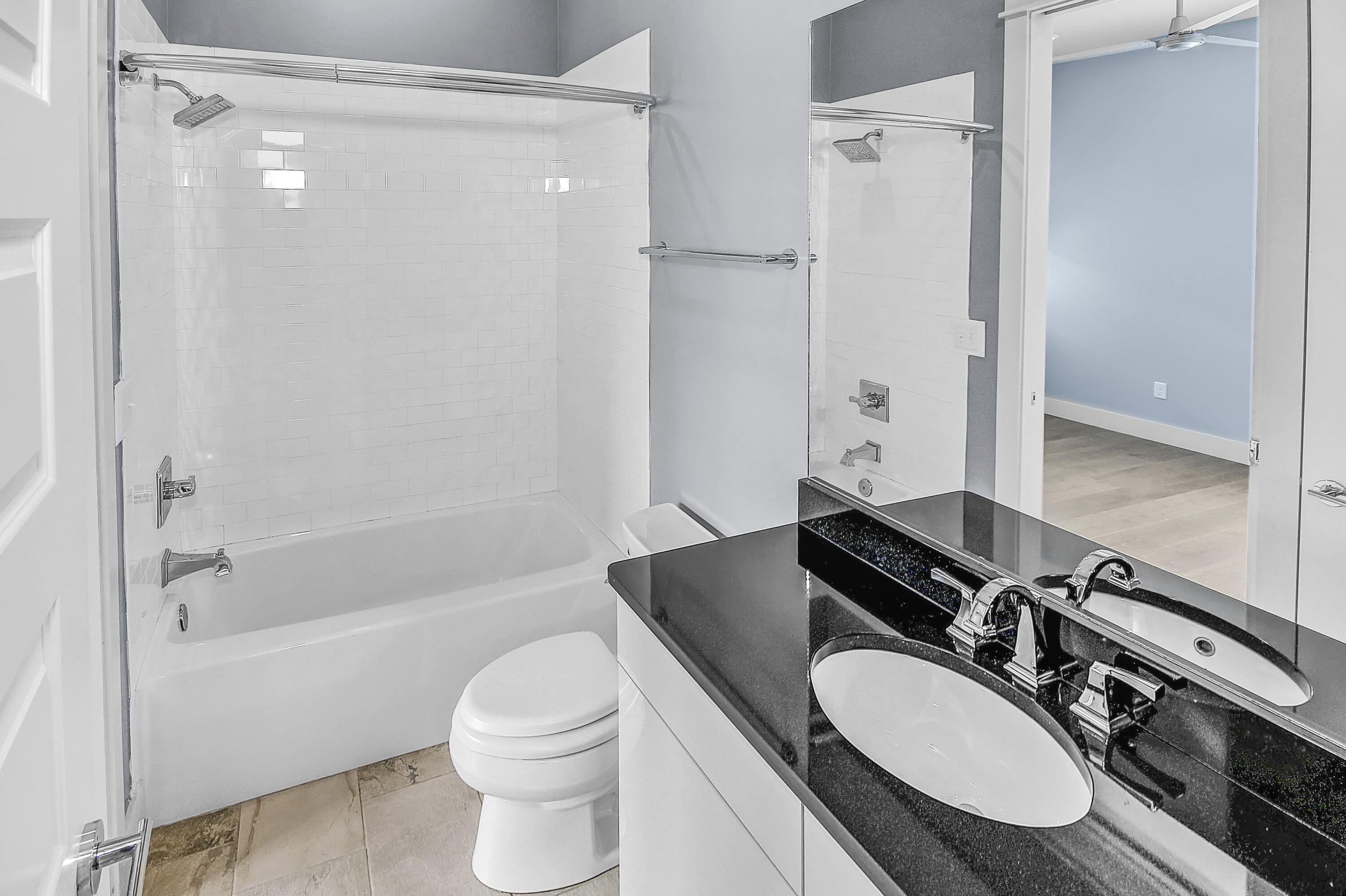 55 Grande Pointe Circle Inlet Beach, FL 32461 - Photo 26 of 32 a bathroom with a granite countertop sink toilet a mirror and shower