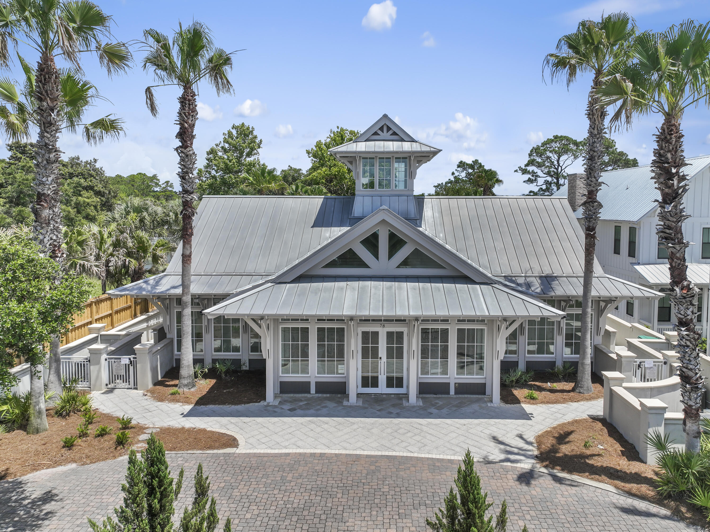 55 Grande Pointe Circle Inlet Beach, FL 32461 - Photo 28 of 32 a front view of a house with a yard and potted plants