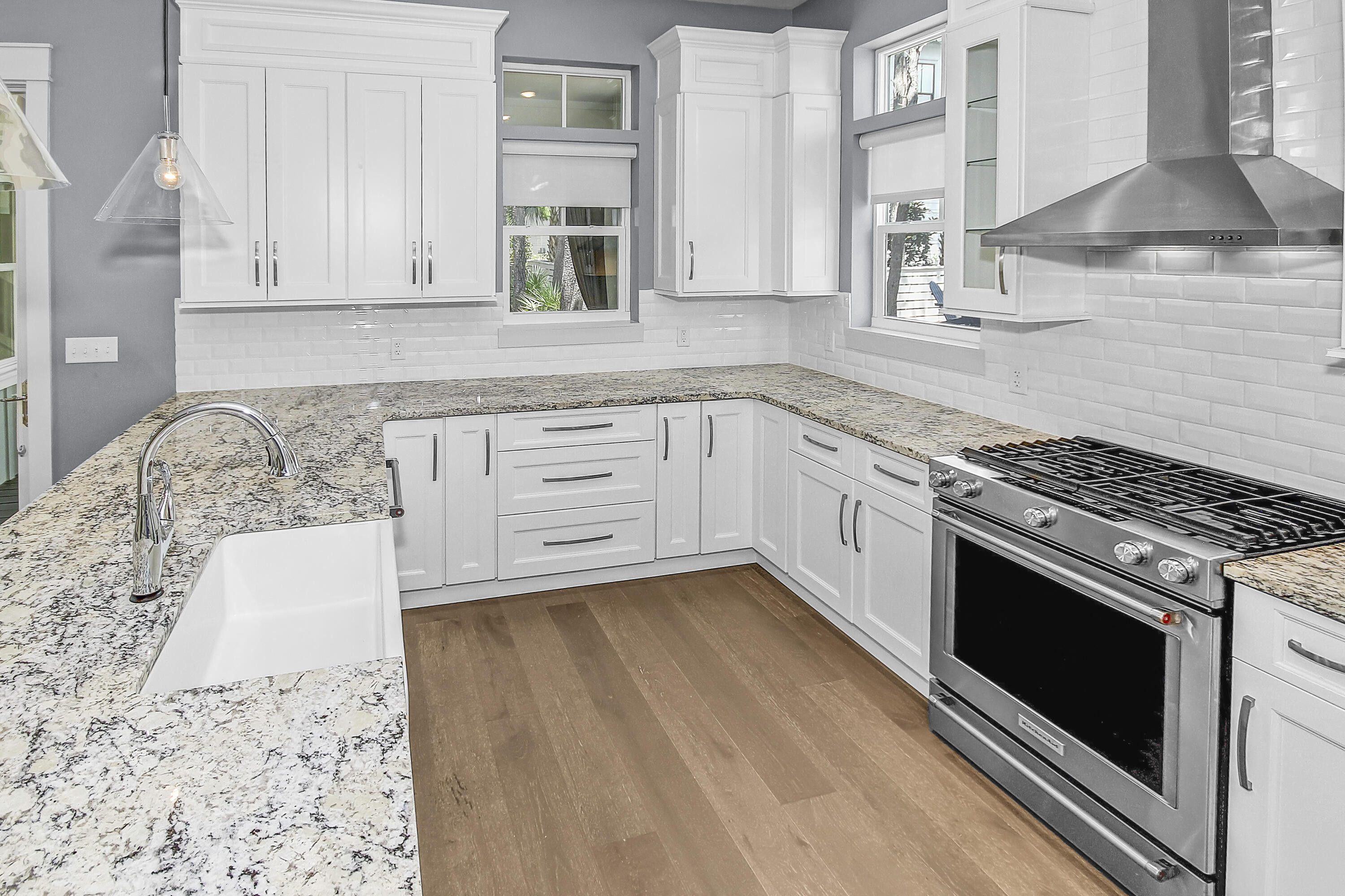 55 Grande Pointe Circle Inlet Beach, FL 32461 - Photo 10 of 32 a kitchen with granite countertop a stove a sink and a microwave