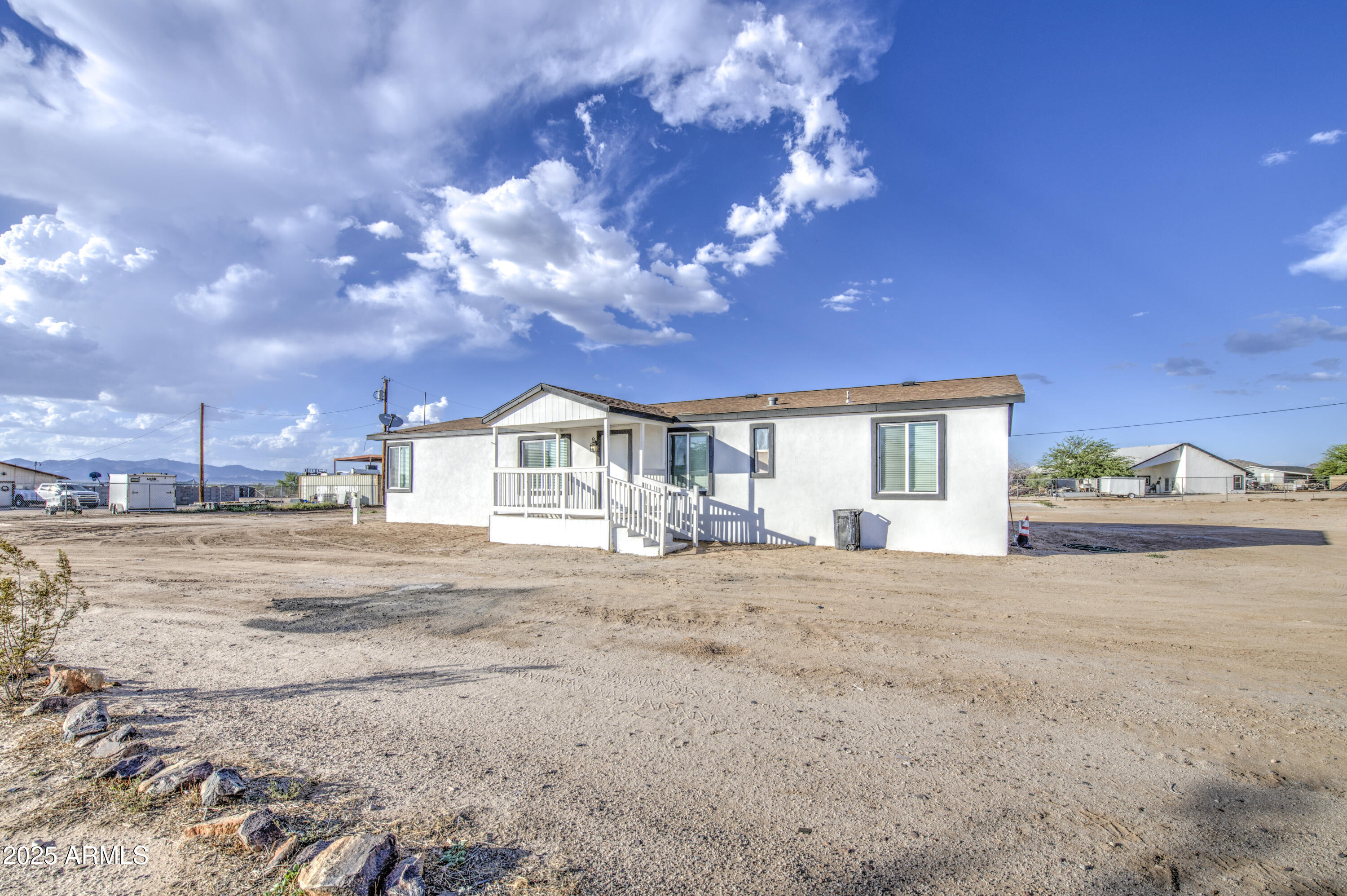 19954 West Teepee Road Buckeye, AZ 85326 - Photo 1 of 46 a view of a house with a yard