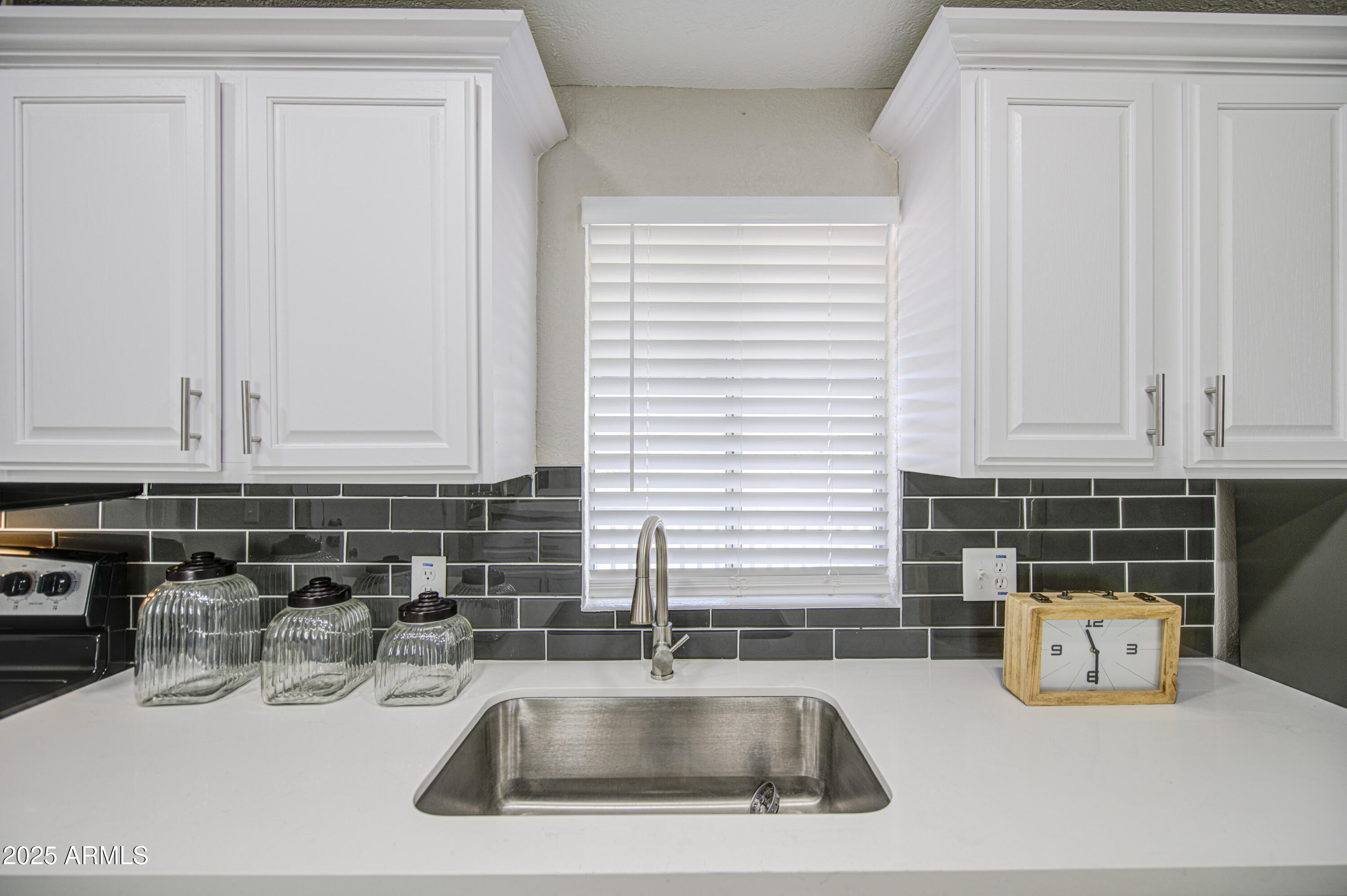 19954 West Teepee Road Buckeye, AZ 85326 - Photo 18 of 46 a kitchen with a sink and cabinets