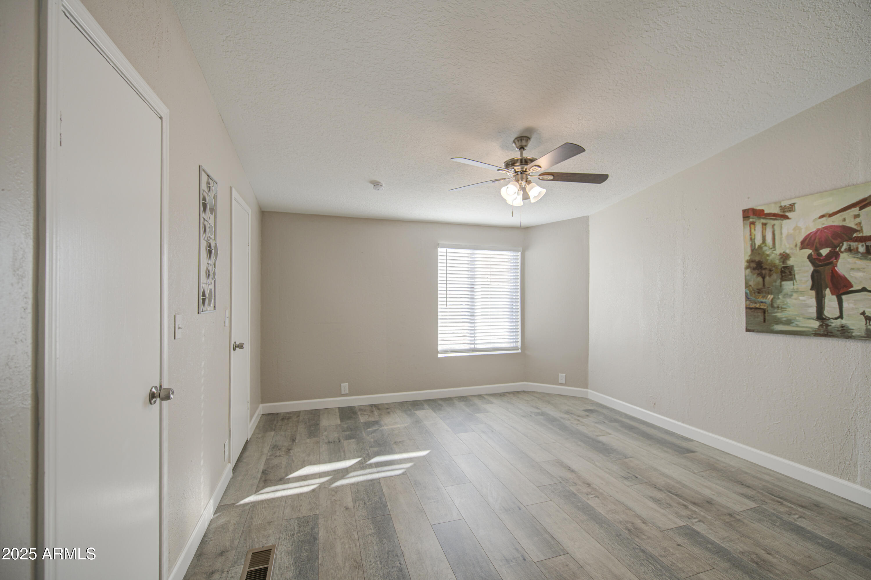 19954 West Teepee Road Buckeye, AZ 85326 - Photo 25 of 46 a view of an empty room with a window