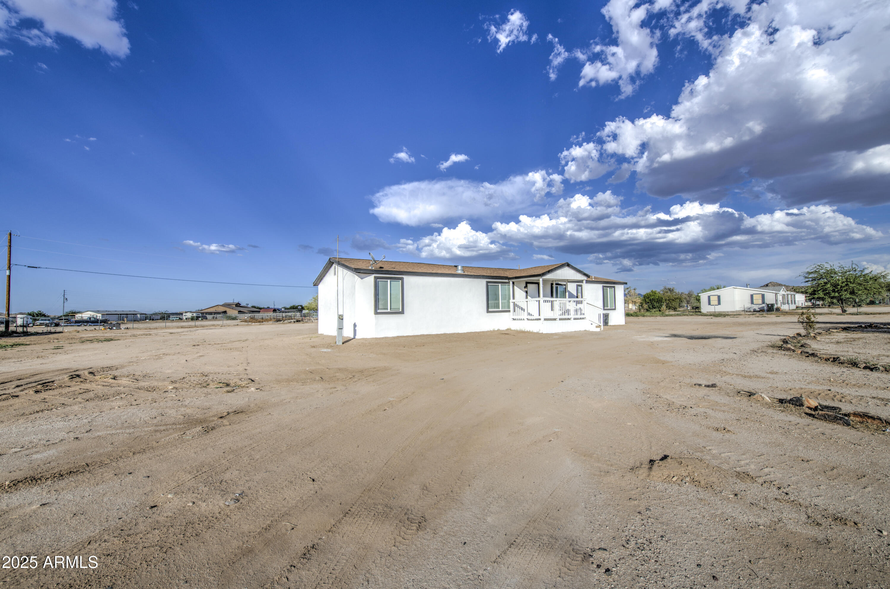 19954 West Teepee Road Buckeye, AZ 85326 - Photo 3 of 46 a view of a building with a road
