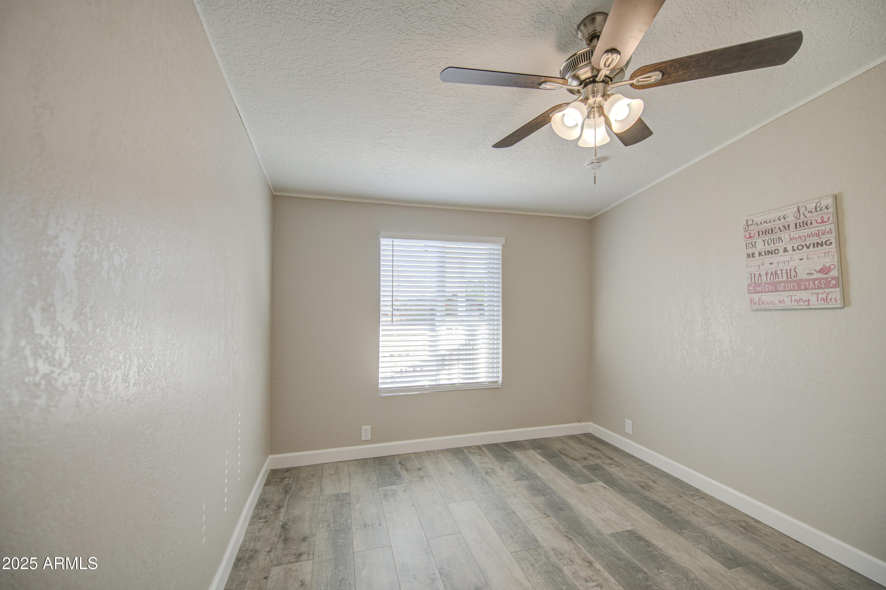 19954 West Teepee Road Buckeye, AZ 85326 - Photo 33 of 46 an empty room with a window and a fan