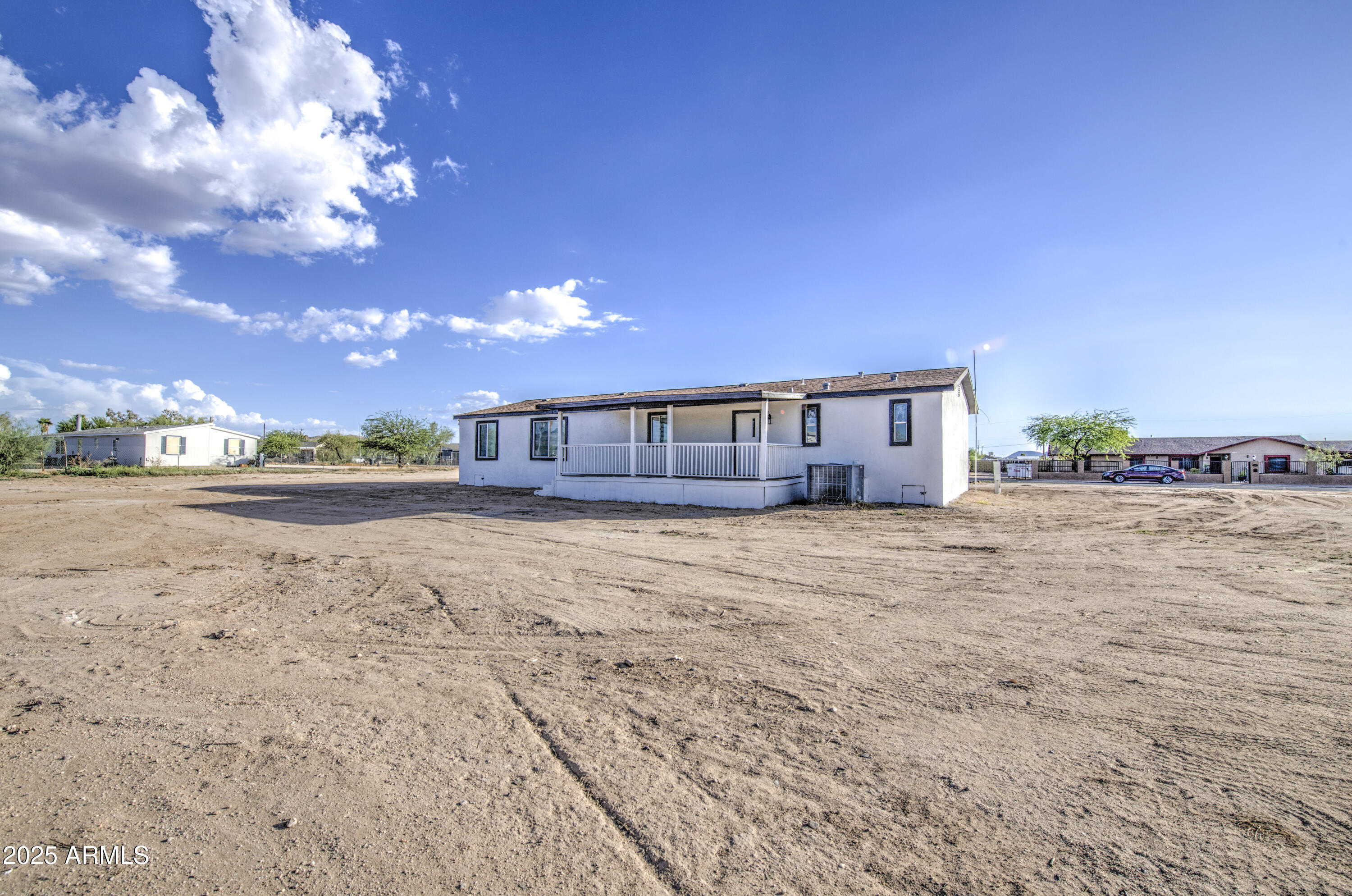 19954 West Teepee Road Buckeye, AZ 85326 - Photo 46 of 46 a view of a house with a yard
