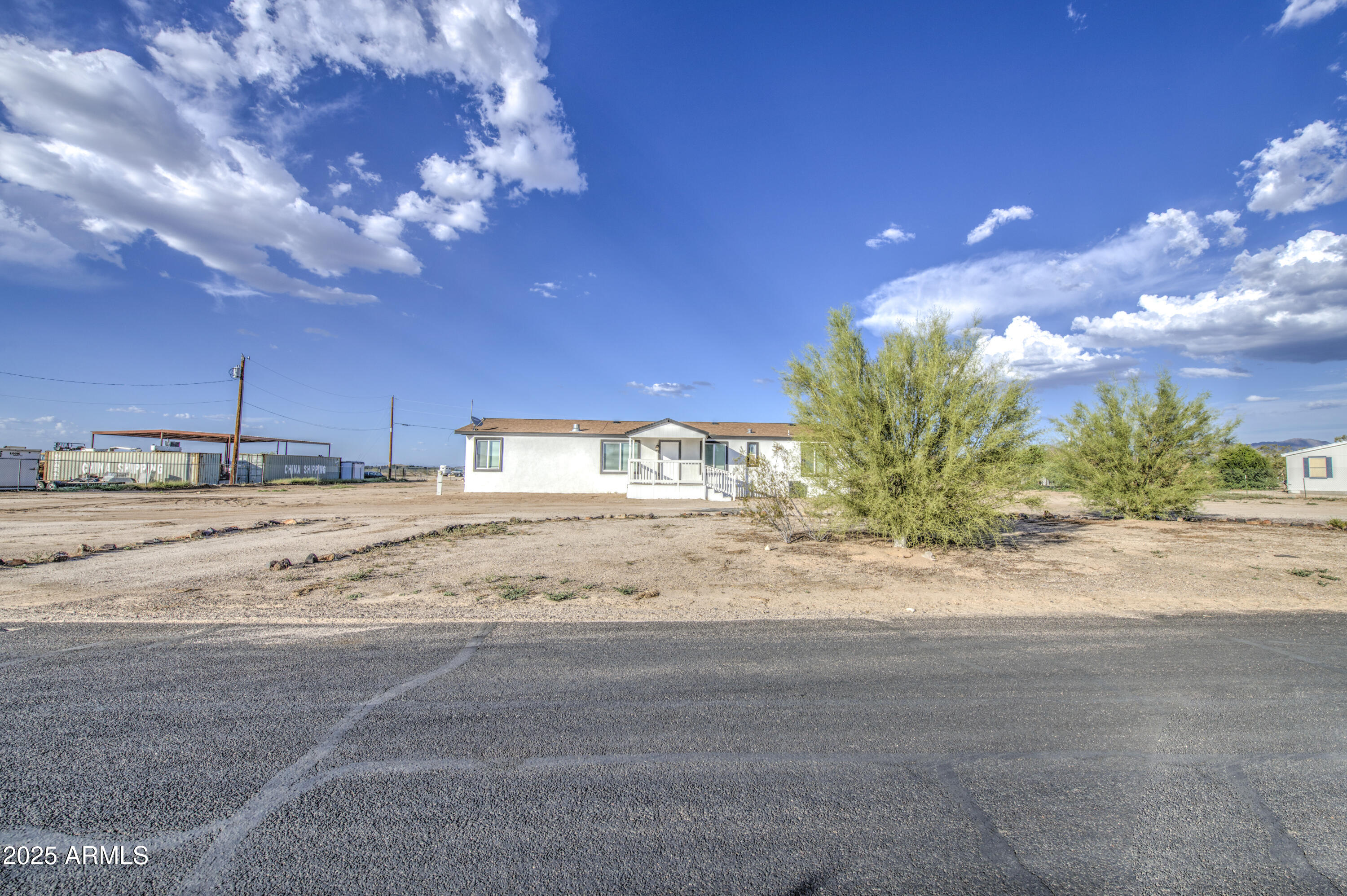 19954 West Teepee Road Buckeye, AZ 85326 - Photo 5 of 46 a view of a backyard of a house