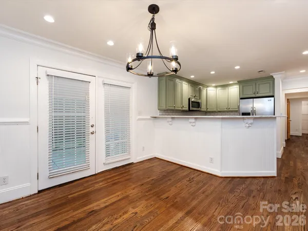 a view of a kitchen with marble kitchen and stainless steel appliances