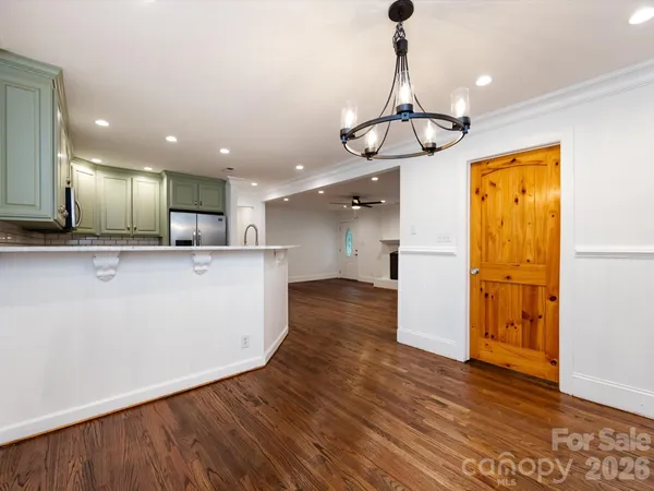 a view of counter top space and stainless steel appliances