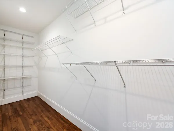 a view of a room with racks on the wall