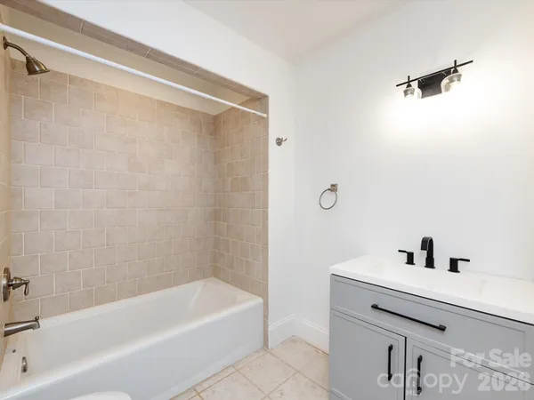 a bathroom with a bathtub and a sink