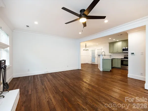 a view of a kitchen with a sink and microwave