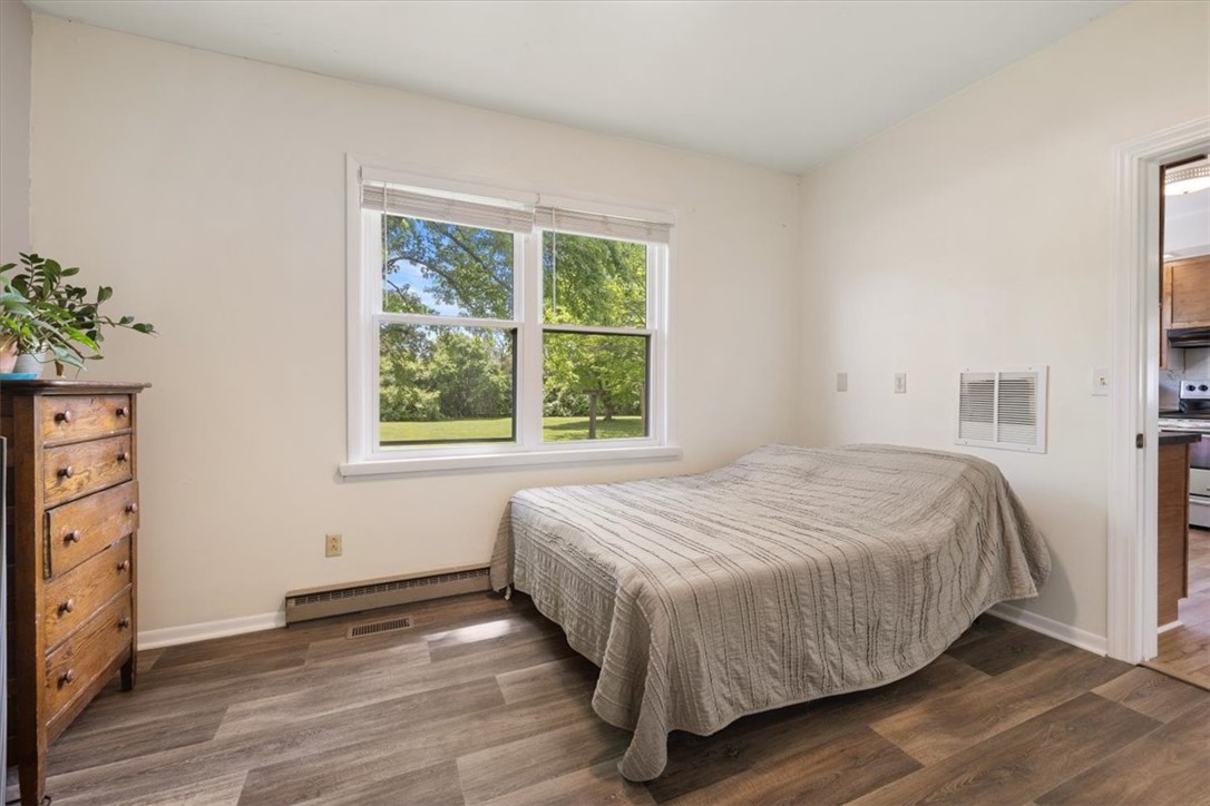 5120 Wheelock Road Troy, OH 45373 - Photo 22 of 67 This cozy bedroom features durable vinyl flooring and abundant natural light.
