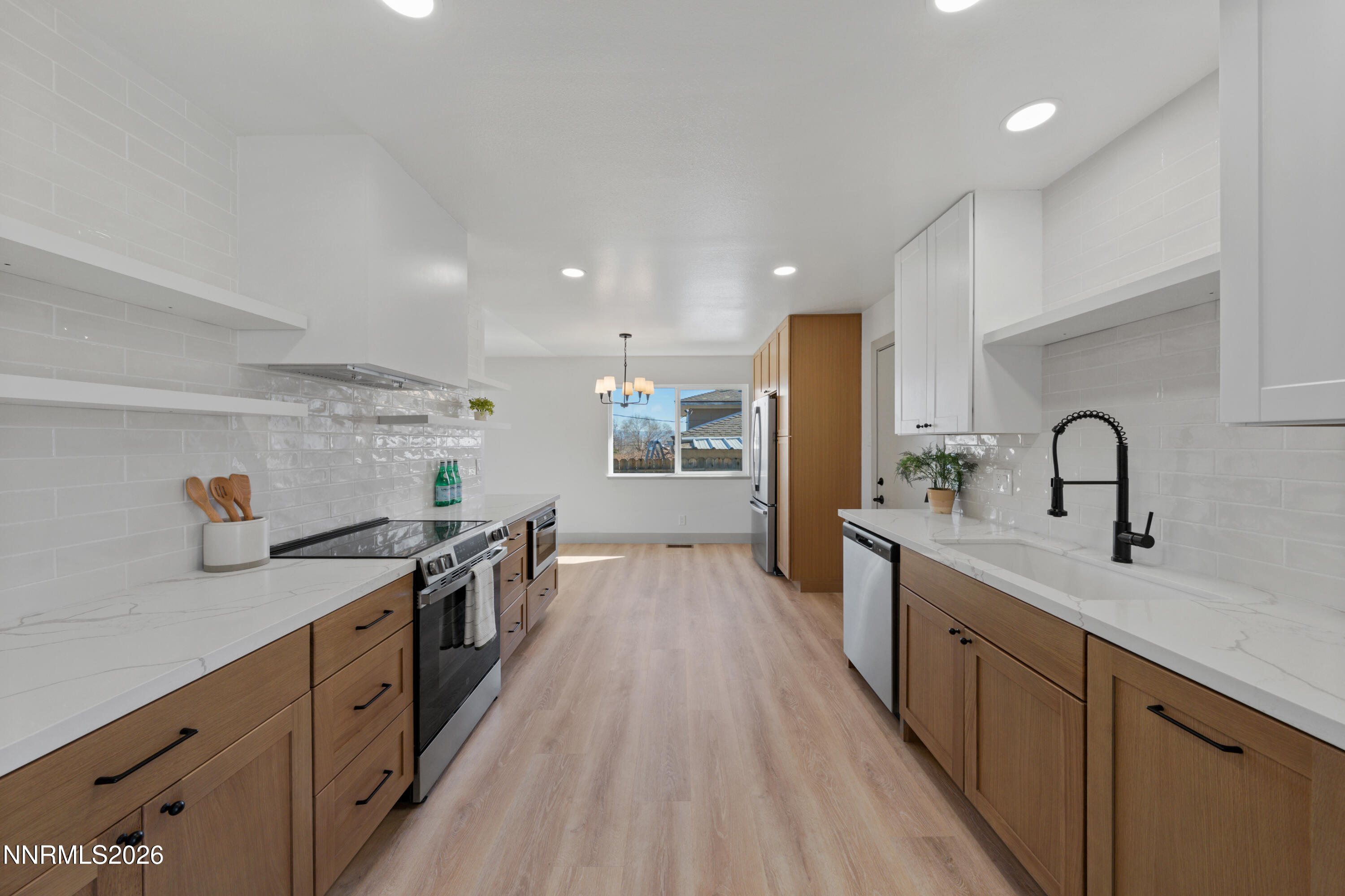 3286 Heights Drive Reno, NV 89503 - Photo 11 of 30 a large kitchen with stainless steel appliances granite countertop a lot of counter space and wooden floors