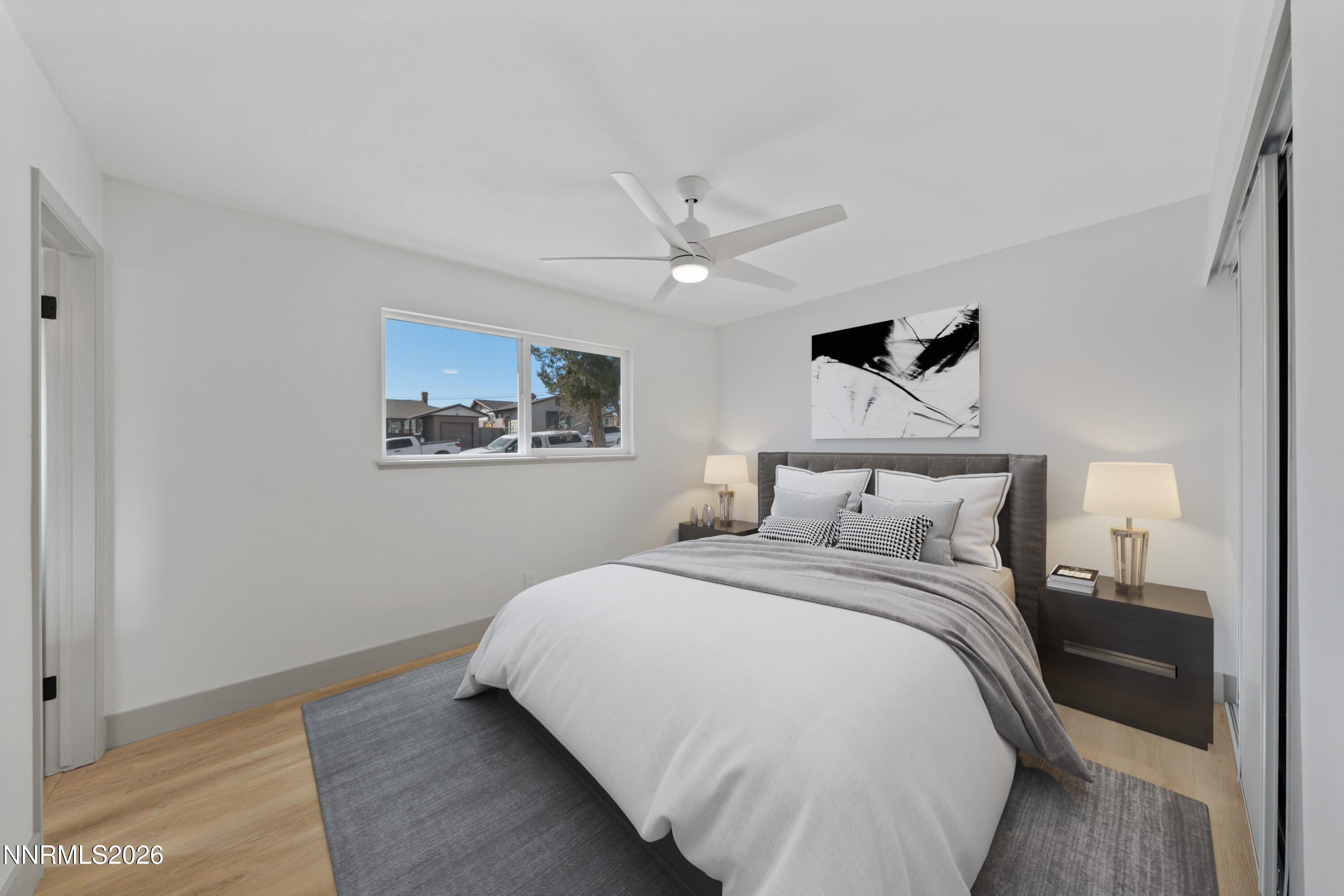 3286 Heights Drive Reno, NV 89503 - Photo 16 of 30 a bedroom with a large bed and a chandelier