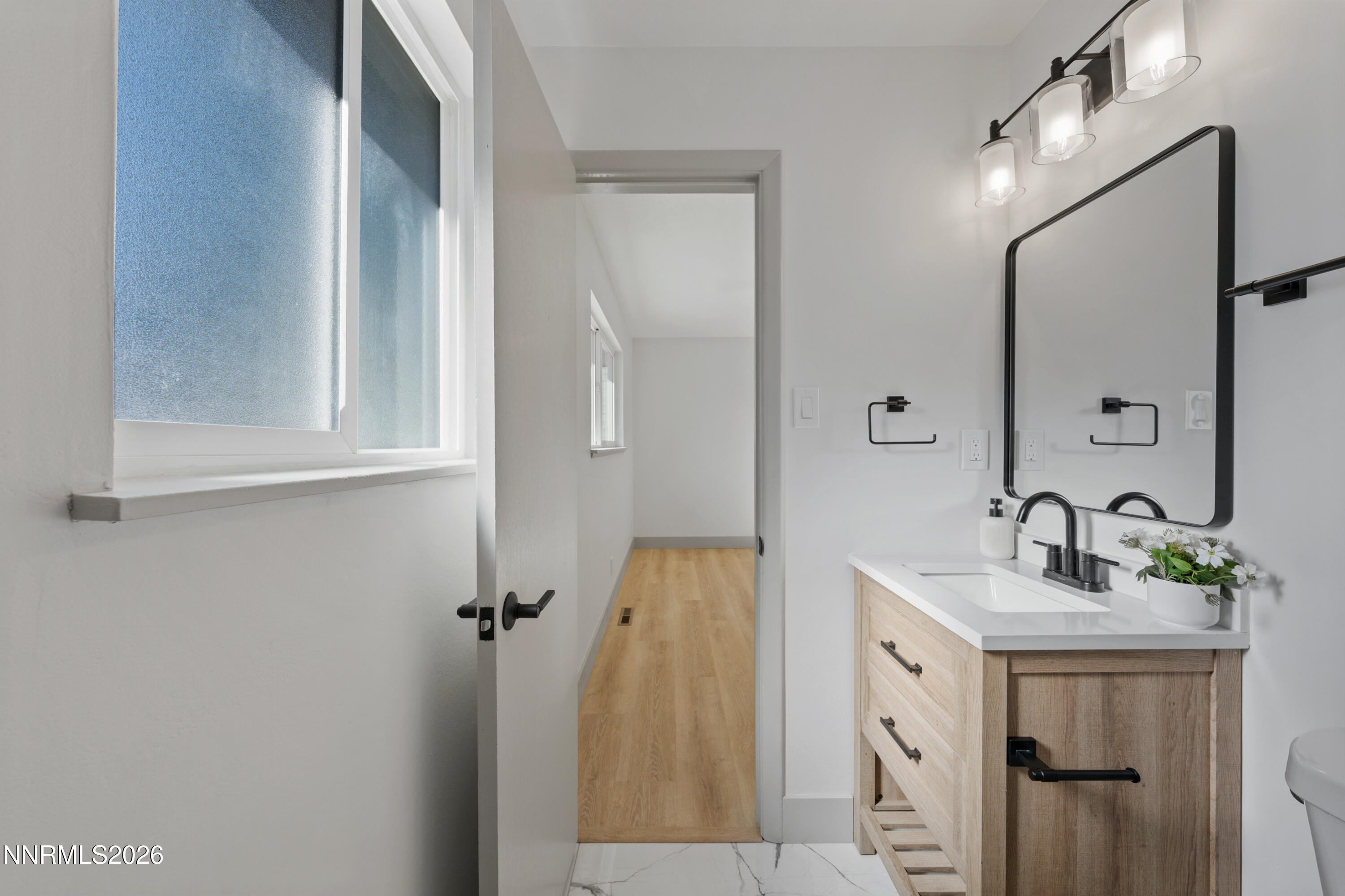 3286 Heights Drive Reno, NV 89503 - Photo 18 of 30 a bathroom with a sink vanity and a mirror