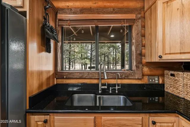 a dining table with chairs and window