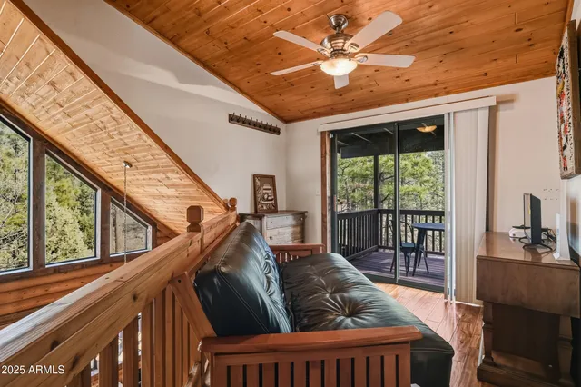 a view of a swimming pool with seating space