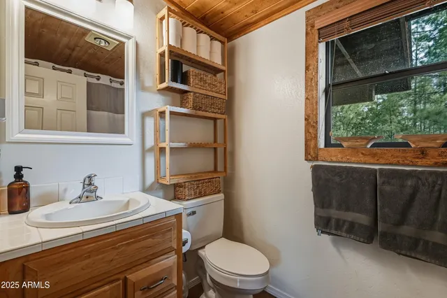 a view of balcony with wooden floor and fence
