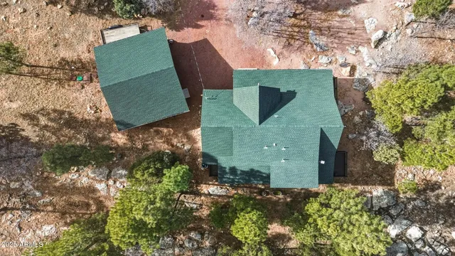 a view of a small house with a yard