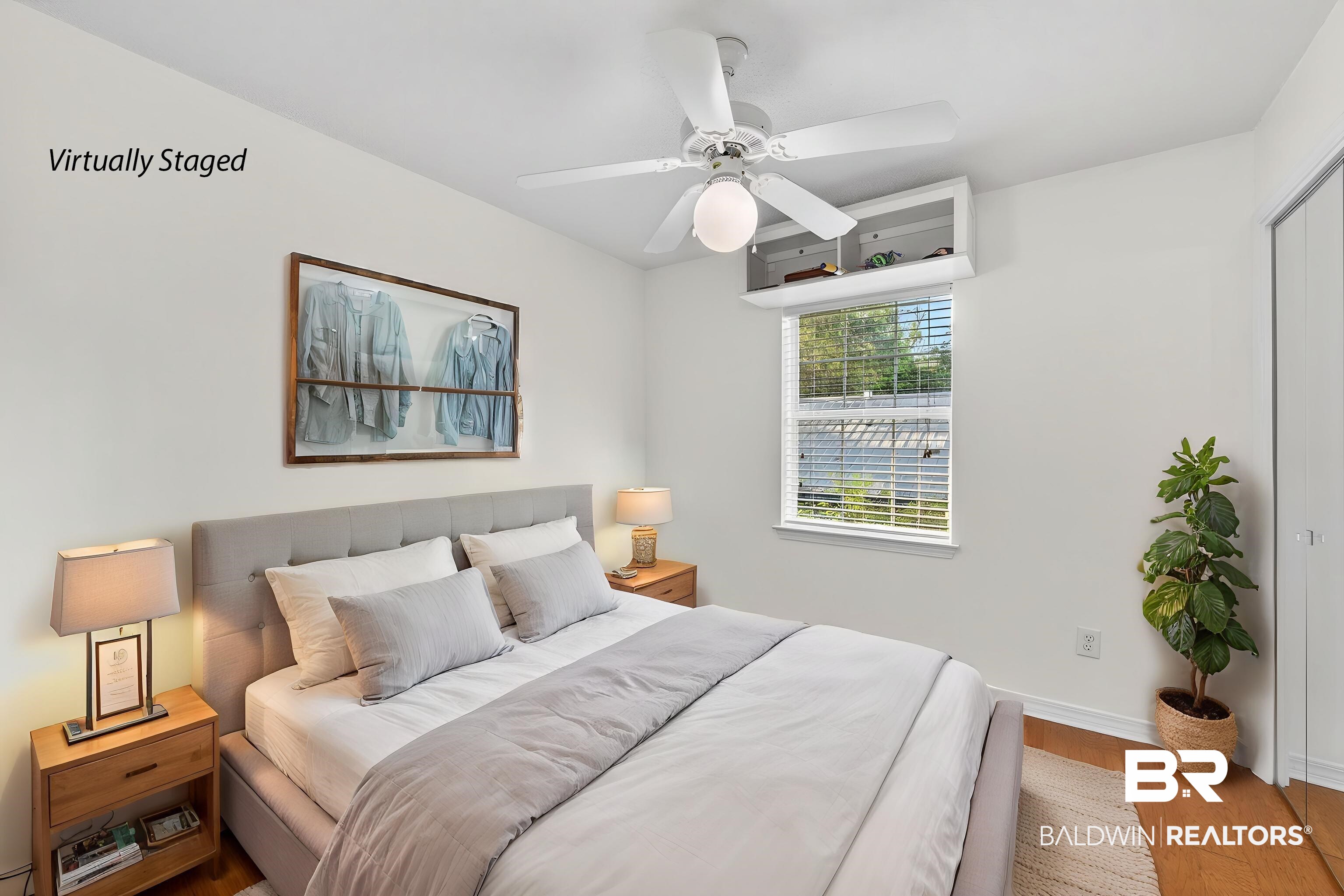 9624 North Bay Street Foley, AL 36535 - Photo 29 of 59 Bedroom featuring a ceiling fan with integrated lighting, a window with horizontal blinds, built-in overhead storage, and wood-finish flooring