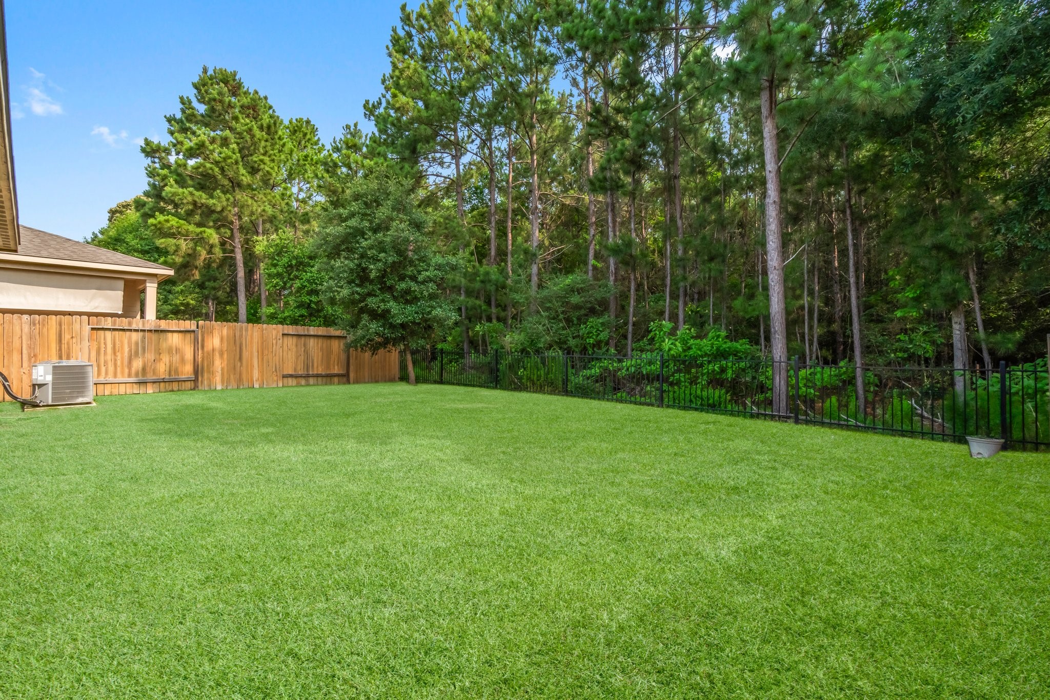 7643 Glaber Leaf Road Conroe, TX 77304 - Photo 22 of 26 Oversized 50 foot lot, overlooking the greenbelt, makes this yard feel bigger.