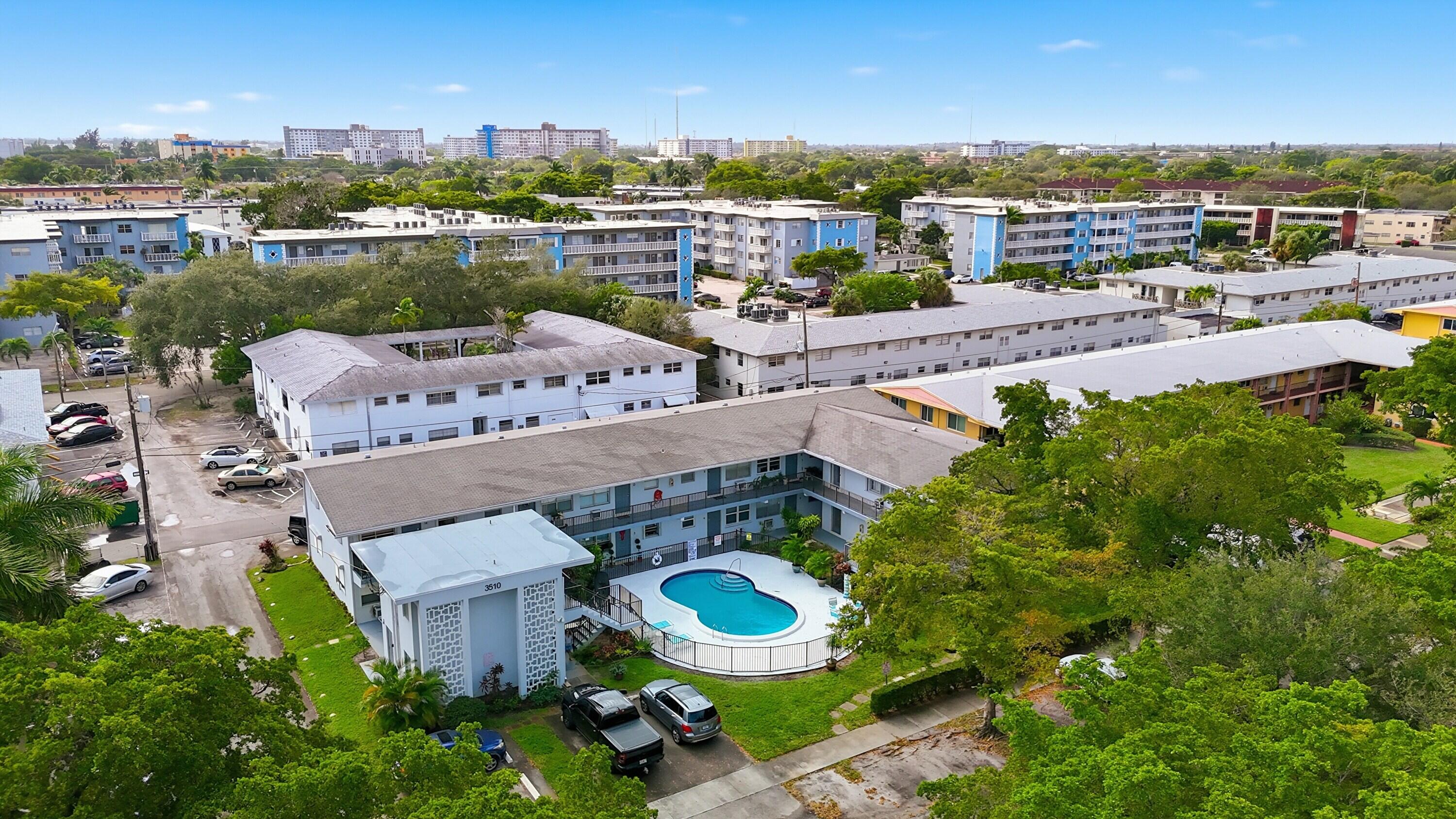3510 Harrison Street, Unit 4 Hollywood, FL 33021 - Photo 31 of 31 an aerial view of a house with garden space and outdoor seating