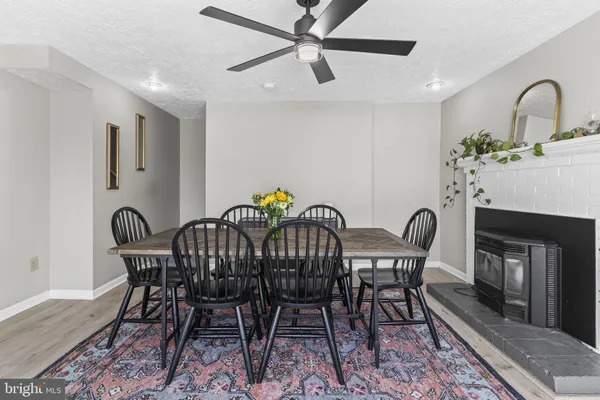 a kitchen with stainless steel appliances granite countertop a sink dishwasher stove and microwave with wooden cabinets