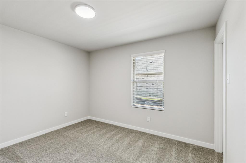 697 Poppy Lane Lavon, TX 75166 - Photo 23 of 27 an empty room with a window