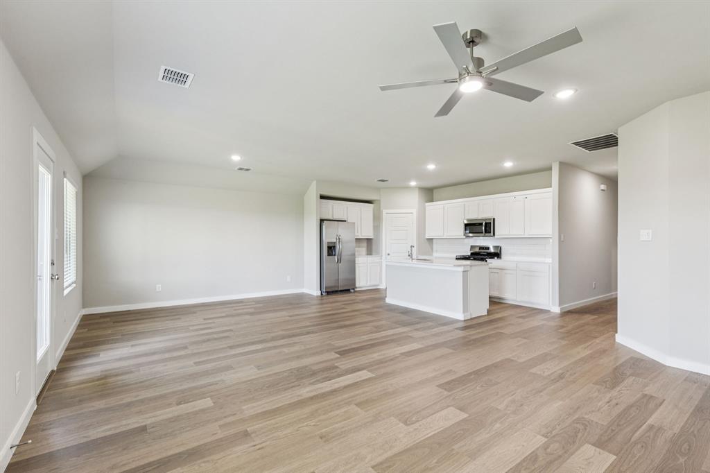 697 Poppy Lane Lavon, TX 75166 - Photo 10 of 27 a view of kitchen with cabinets and wooden floor