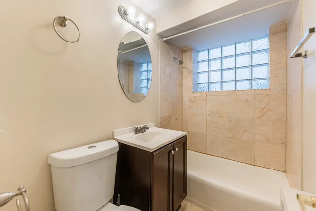 a bathroom with a sink a toilet and a bathtub