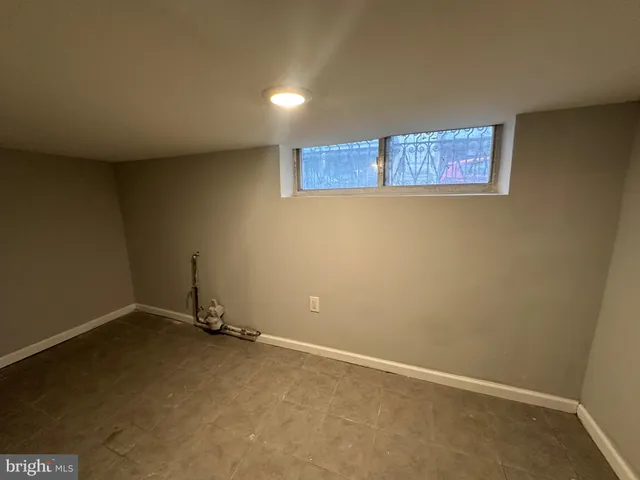 an empty room with a bench