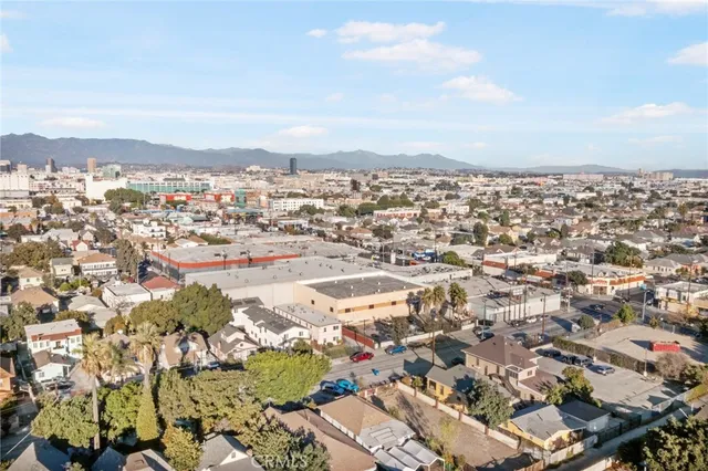 an aerial view of residential building and car parked