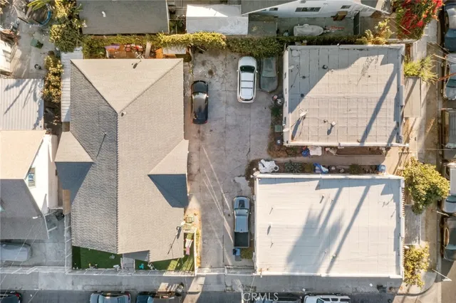 an aerial view of a house with a kitchen and a fireplace