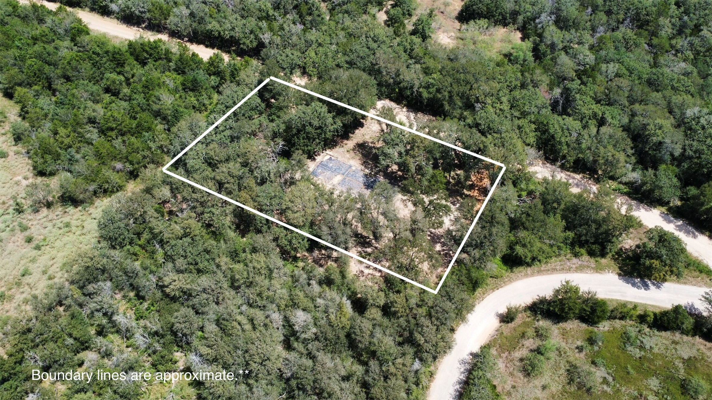 959 Carter Road Dale, TX 78616 - Photo 2 of 20 Mature trees surround a cleared homesite on this secluded lot bordering a quiet roadway.