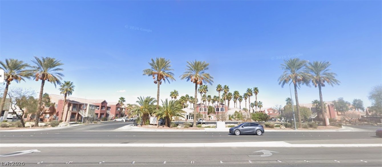 4730 East Craig Road, Unit 2102 Las Vegas, NV 89115 - Photo 1 of 1 Palm-lined streets define this vibrant community, offering a serene desert oasis for residents.