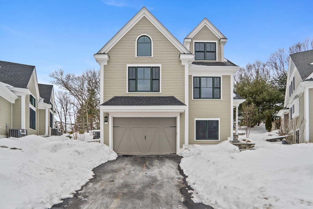 17 Courtyard Place, Unit 17 Reading, MA 01867 - Photo 3 of 12 a view of a house with a yard