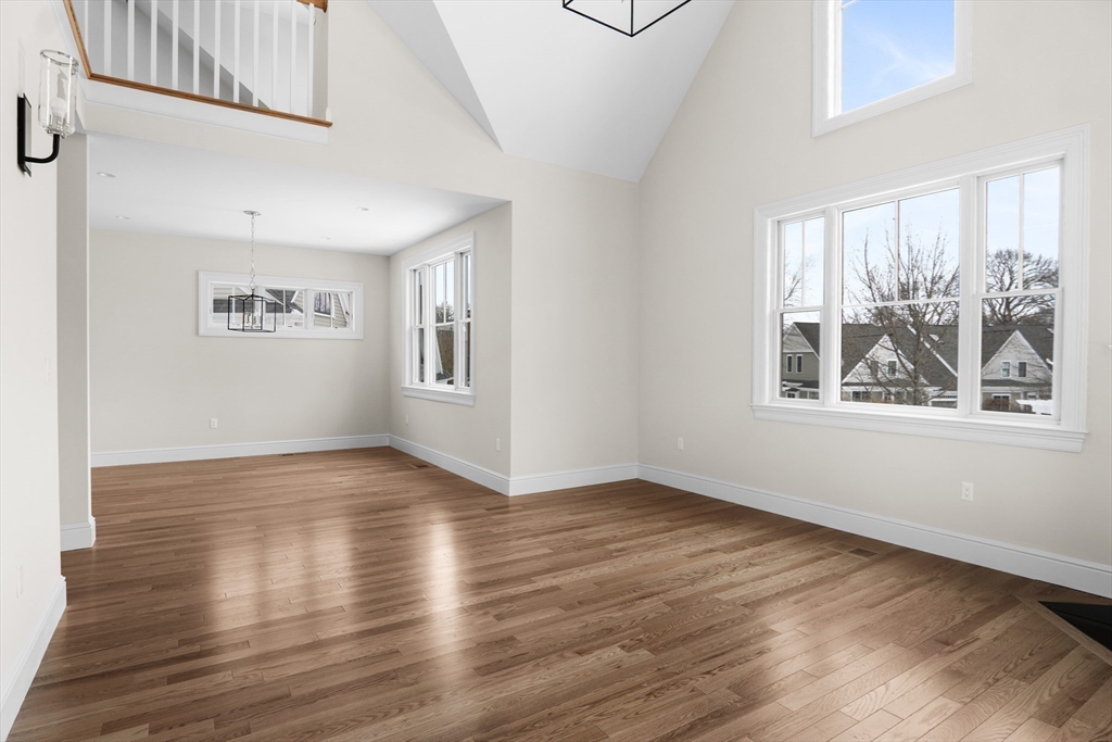 17 Courtyard Place, Unit 17 Reading, MA 01867 - Photo 10 of 12 a view of an empty room with window and wooden floor