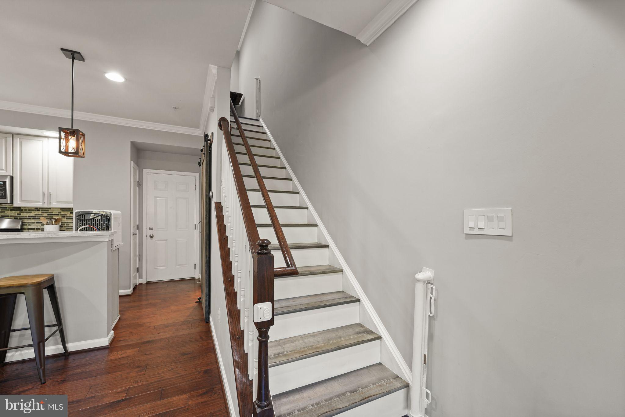 43846 Artsmith Terrace Ashburn, VA 20147 - Photo 15 of 38 a view of entryway and hall with wooden floor