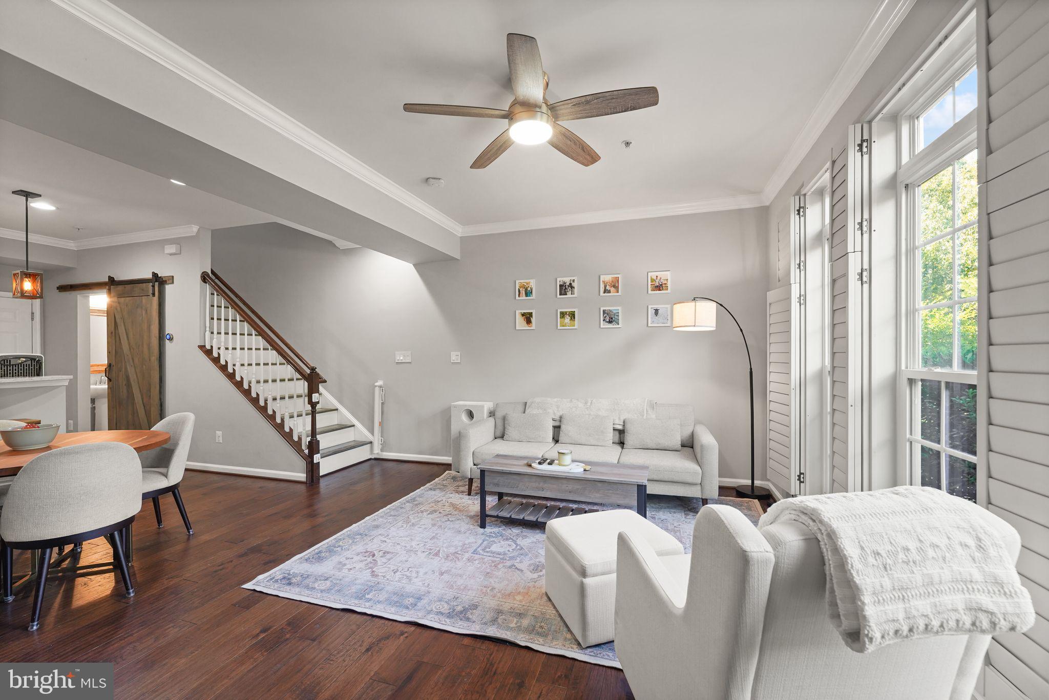 43846 Artsmith Terrace Ashburn, VA 20147 - Photo 2 of 38 a living room with furniture and a table