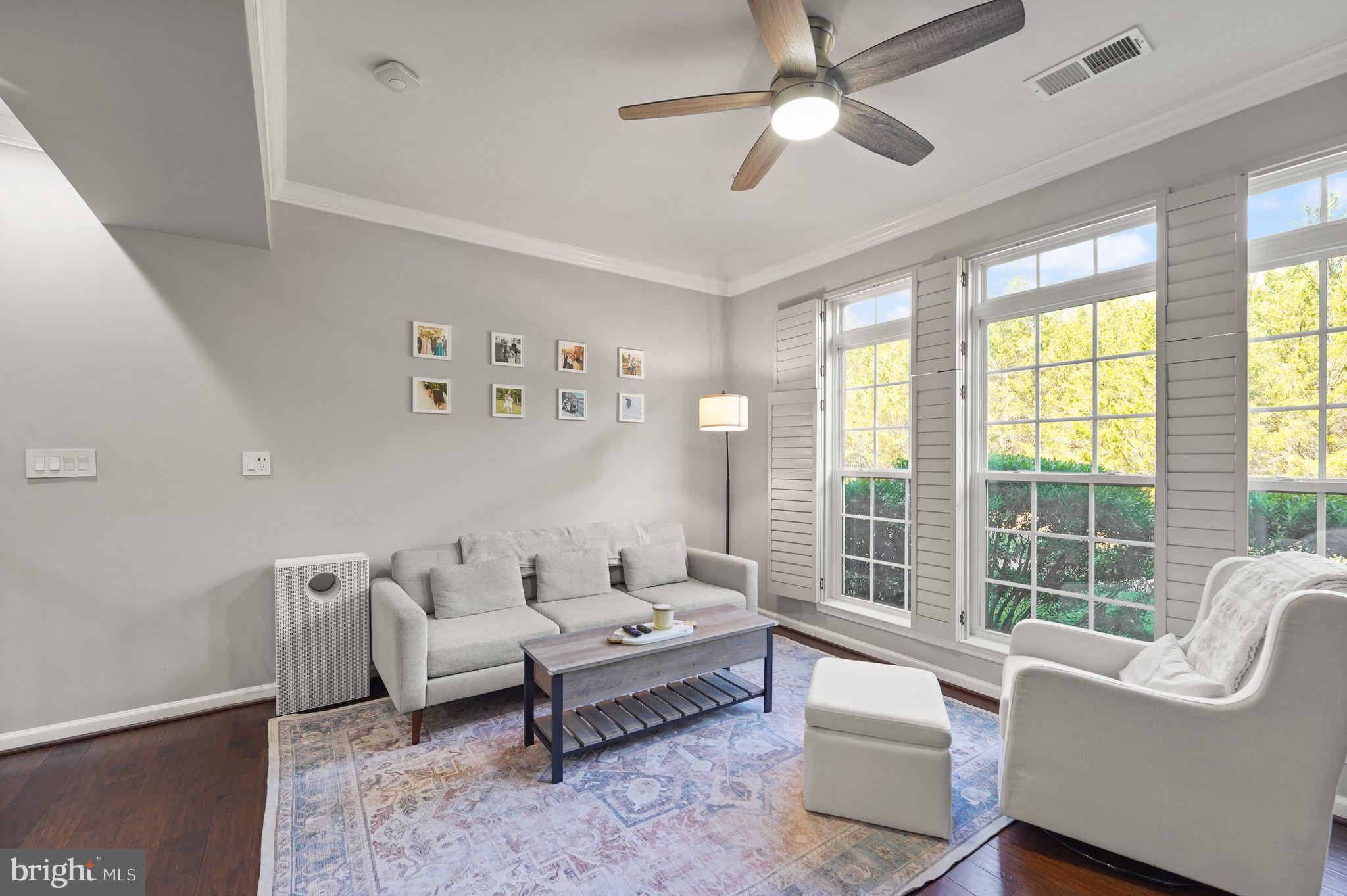43846 Artsmith Terrace Ashburn, VA 20147 - Photo 3 of 38 a living room with furniture and a large window