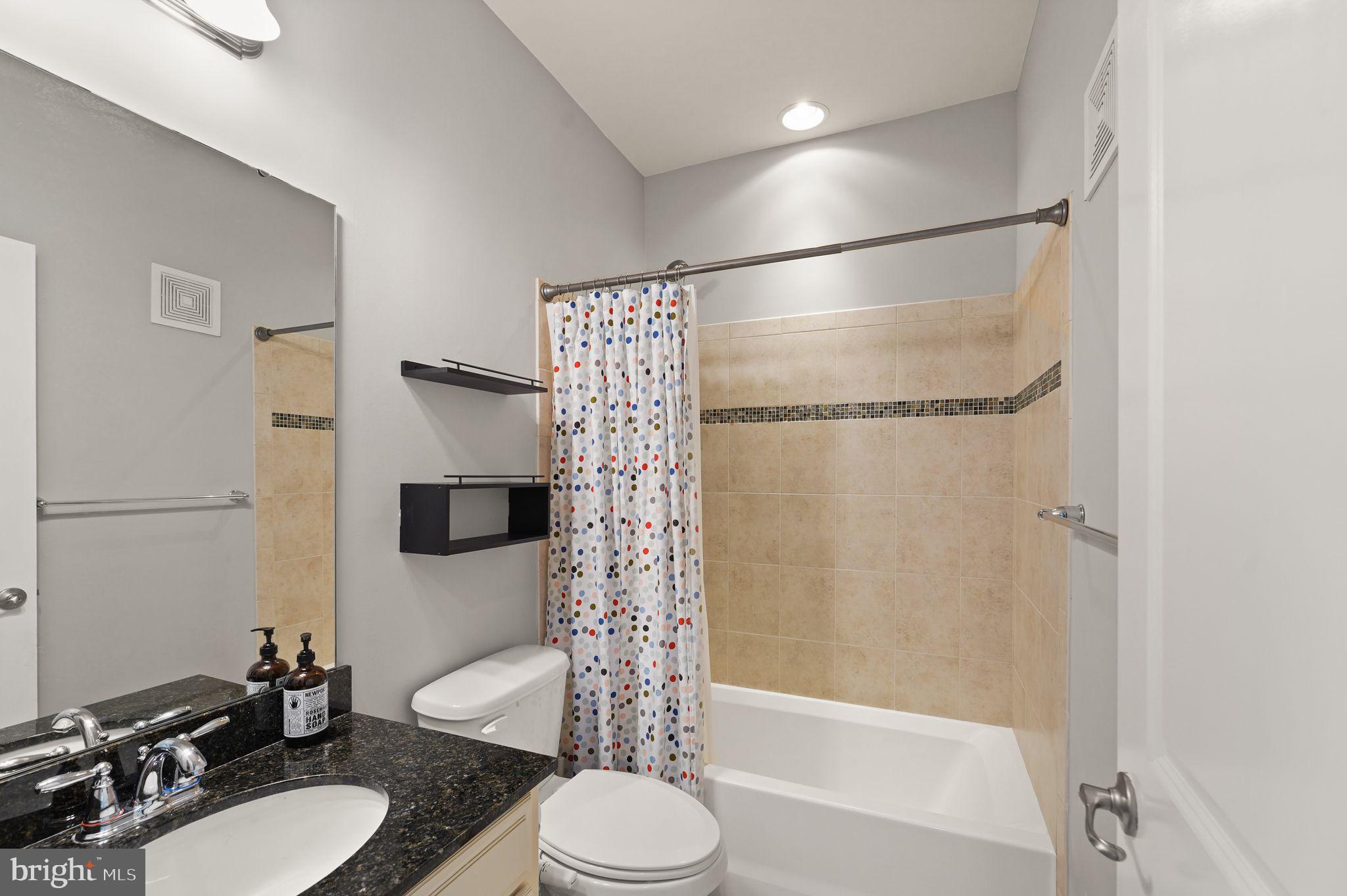 43846 Artsmith Terrace Ashburn, VA 20147 - Photo 32 of 38 a bathroom with a sink toilet and shower