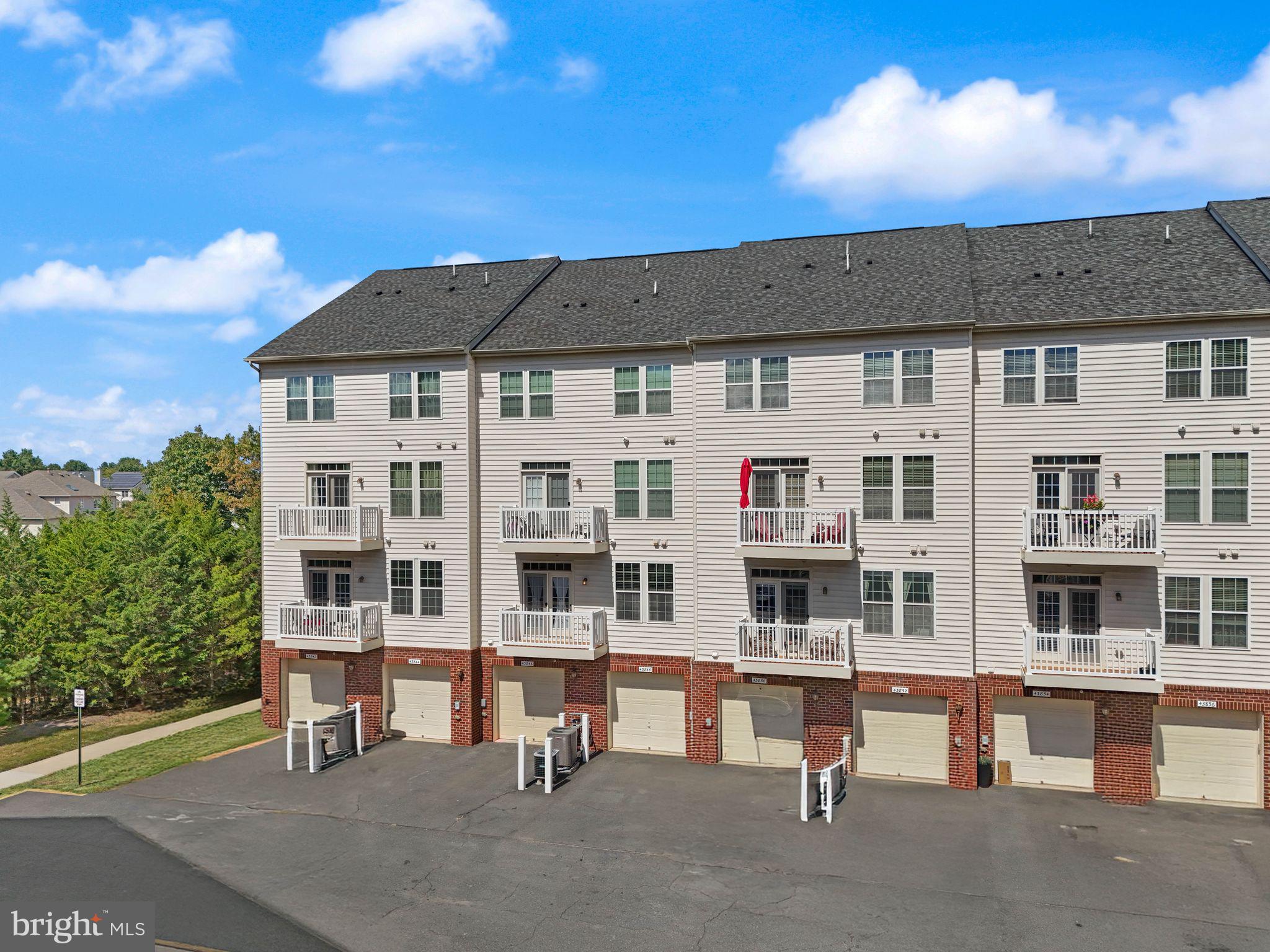 43846 Artsmith Terrace Ashburn, VA 20147 - Photo 34 of 38 a view of multiple houses with a street