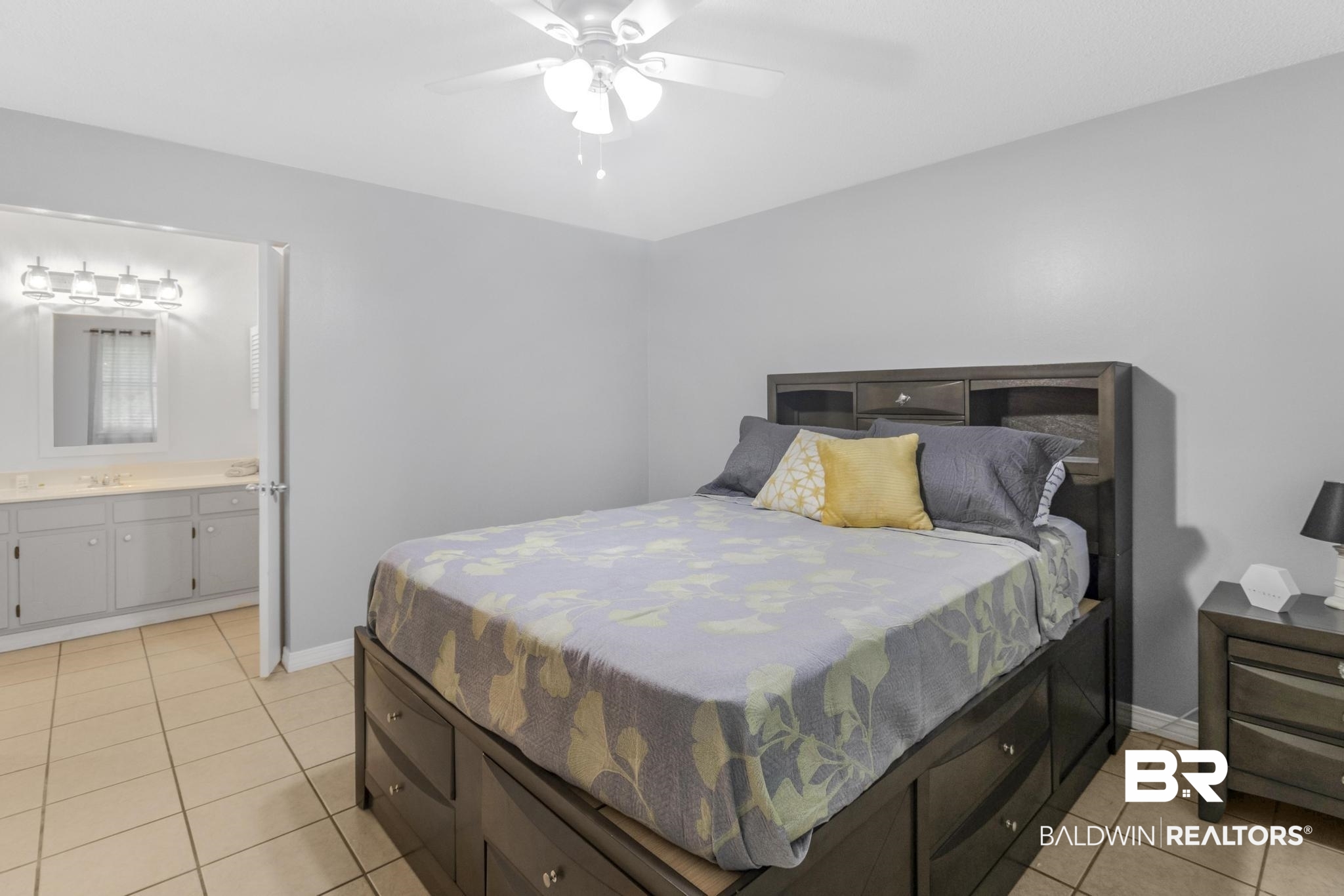 110 5th Street, Unit A 103 Daphne, AL 36526 - Photo 9 of 28 Tiled bedroom with ceiling fan