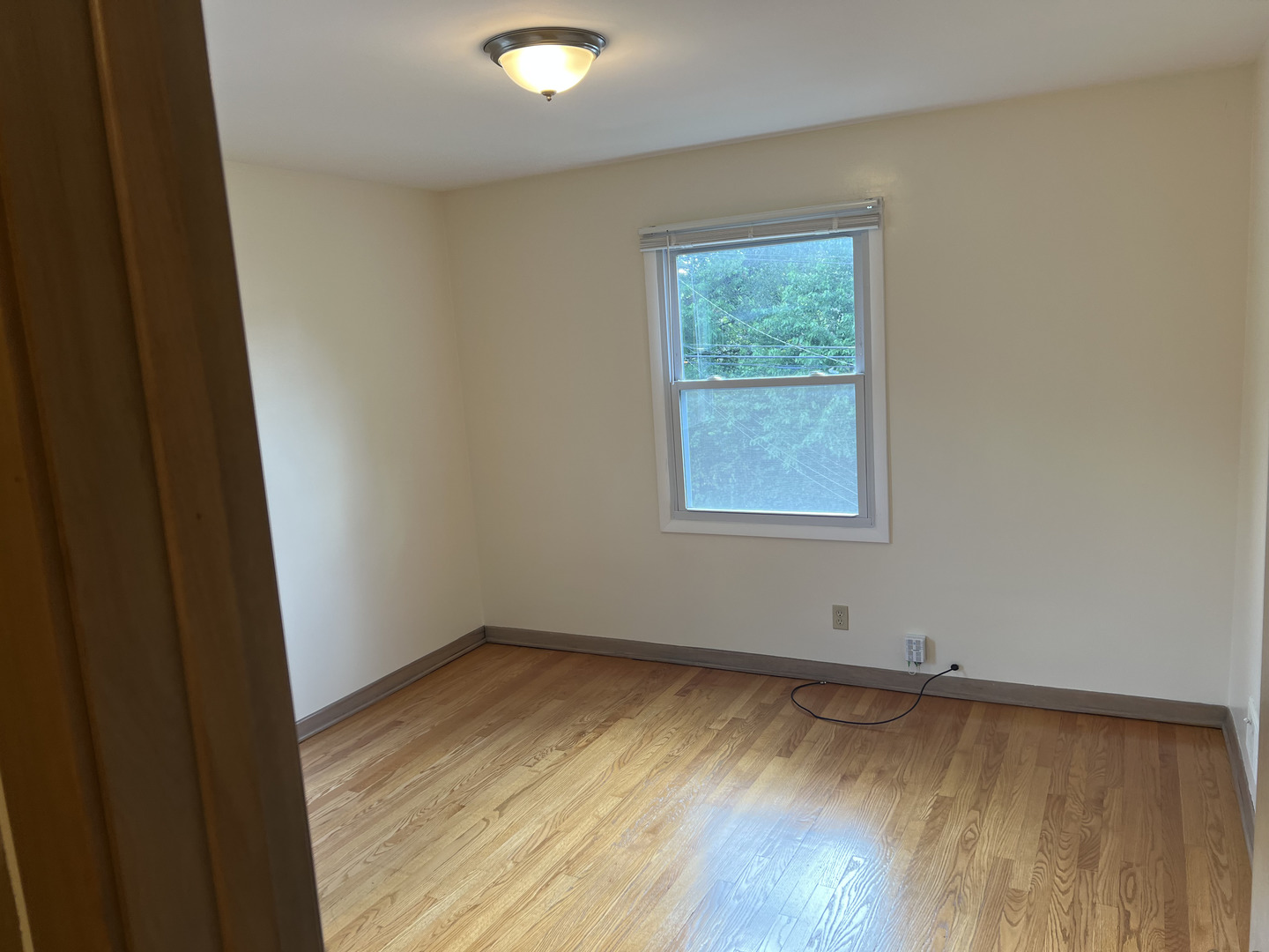 3014 Harlem Avenue, Unit 1 Riverside, IL 60546 - Photo 13 of 22 wooden floor in an empty room with a window