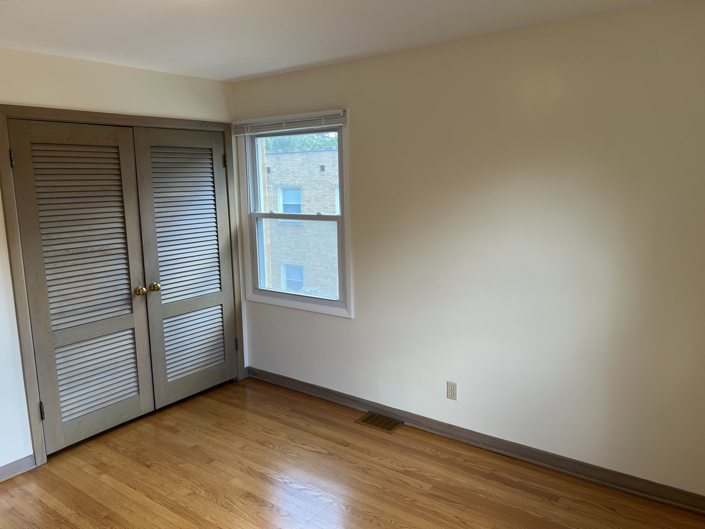 3014 Harlem Avenue, Unit 1 Riverside, IL 60546 - Photo 14 of 22 an empty room with wooden floor and windows