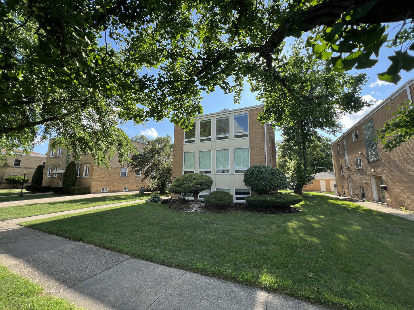 3014 Harlem Avenue, Unit 1 Riverside, IL 60546 - Photo 2 of 22 a view of a house with a yard