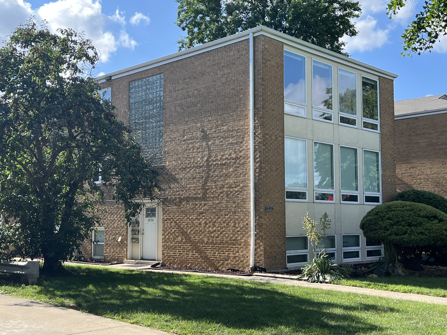 3014 Harlem Avenue, Unit 1 Riverside, IL 60546 - Photo 3 of 22 front view of a house with a yard